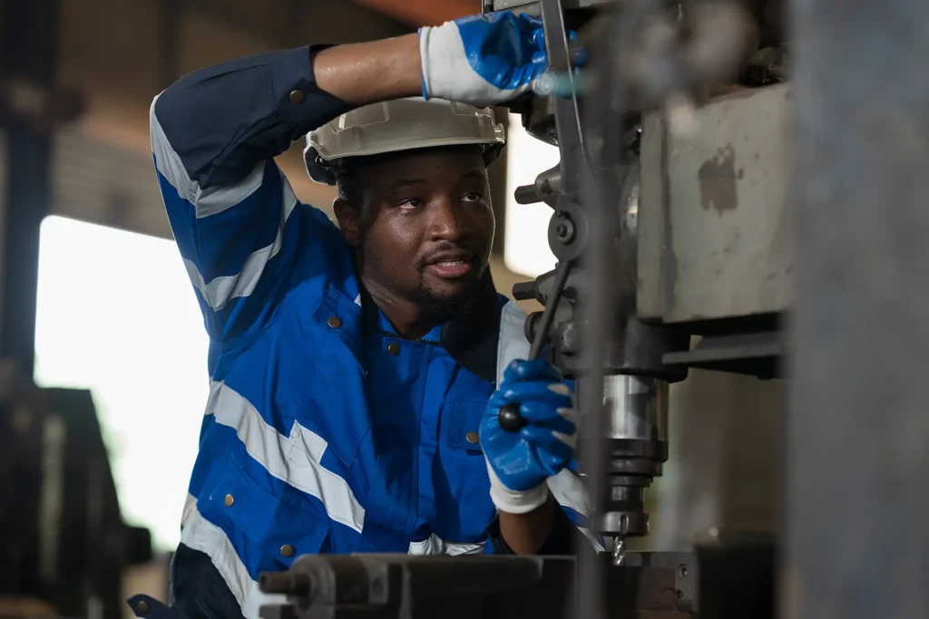 Male engineer worker working with lathe machine