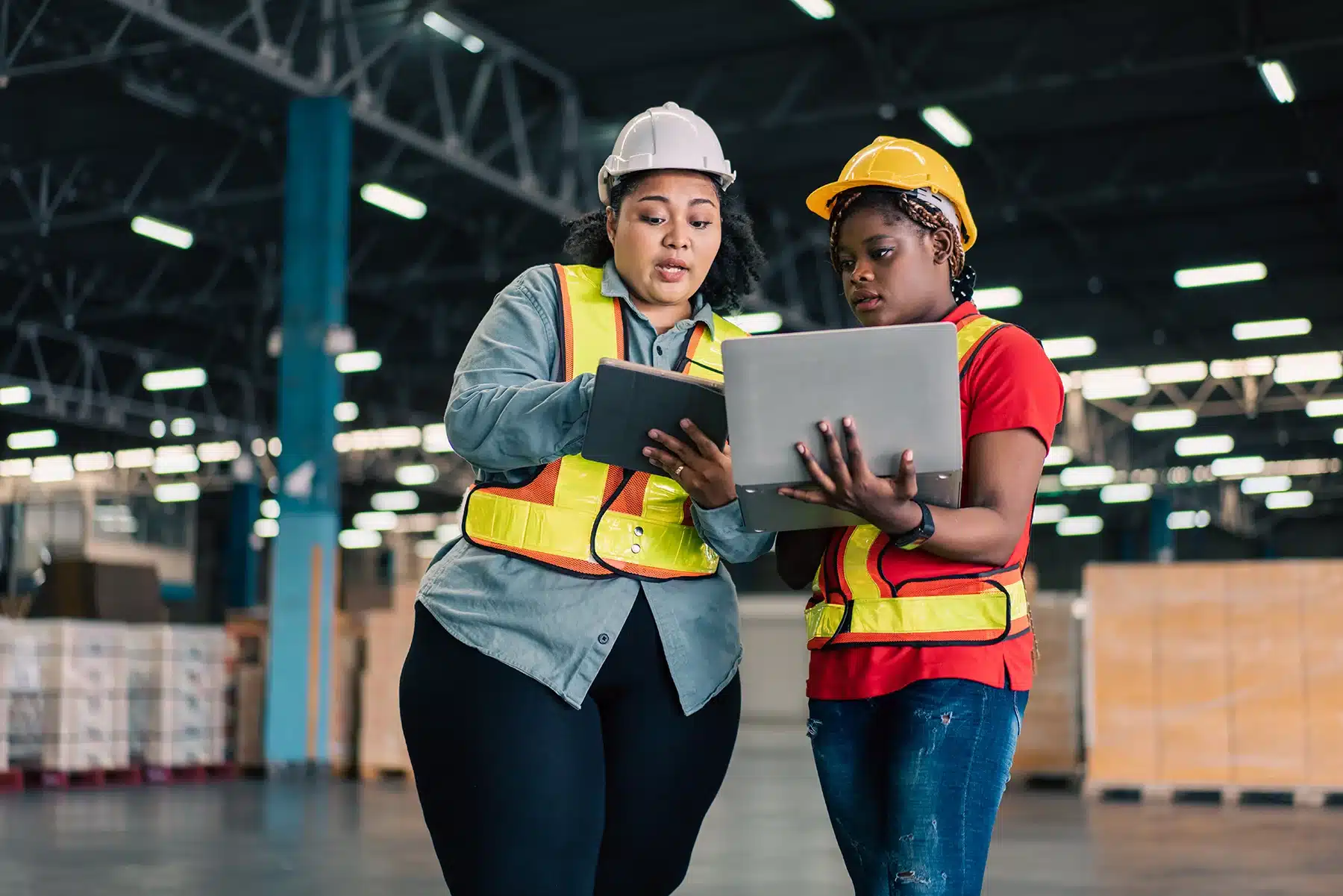 African female manager working with digital tablet checking stock